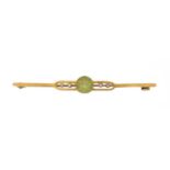 An early 20th century peridot and seed pearl brooch,