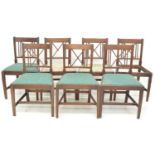 Seven George III mahogany single dining chairs