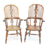 A pair of mid-19th century yew wood and elm hight back Windsor chairs