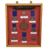 Cabinet containing medals