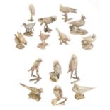 A set of fifteen silver models of birds,