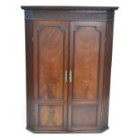 George III mahogany wall hanging corner cupboard