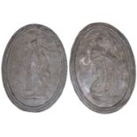 A pair of oval cast lead wall plaques