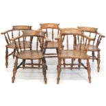 A collection of five late 19th-century beech and elm club chairs