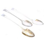 Three silver serving spoons,
