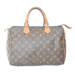 A Louis Vuitton monogram Speedy 30 handbag,