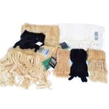 A selection of fur scarves,