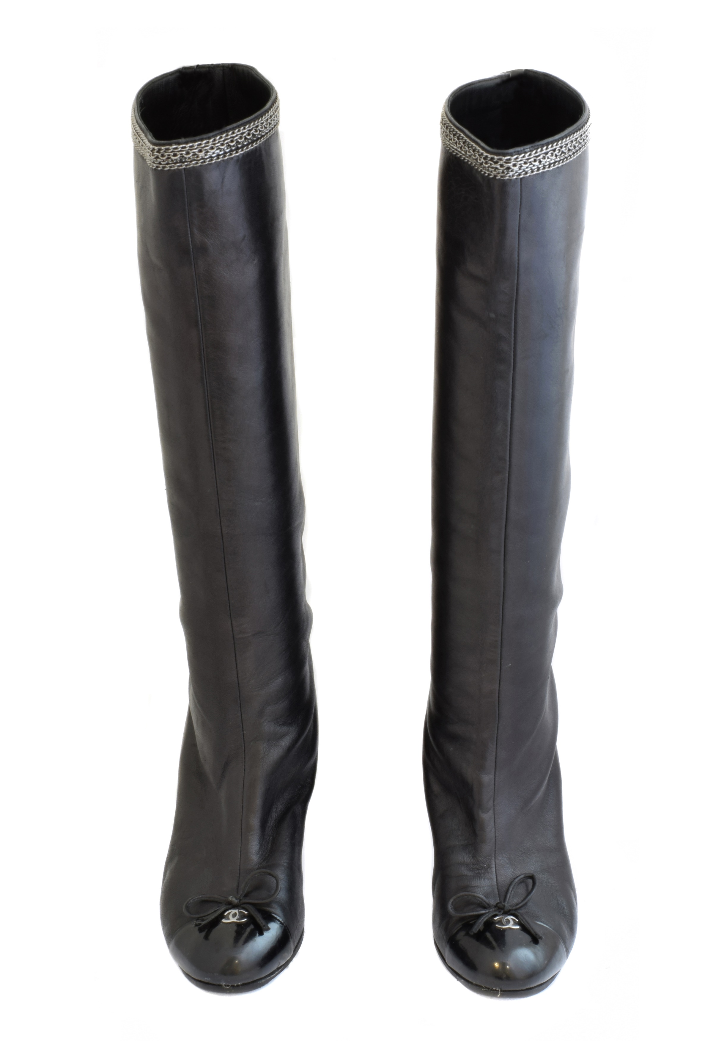 A pair of heeled boots by Chanel,