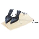 A pair of black leather heels by Loewe,