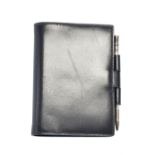 A Hermès Mini Address Book and Silver Mechanical Pencil,