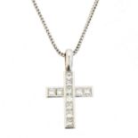 An 18ct gold diamond cross pendant,