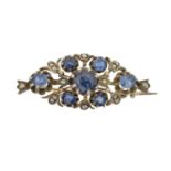 A sapphire and diamond brooch,