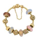 A 14ct gold Pandora charm bracelet,