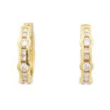 A pair of 18ct gold diamond hoop earrings,