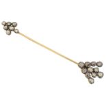 A diamond jabot pin,