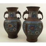A pair of Chinese enamelled bronze baluster vases, with elephant mask handles, height 12ins