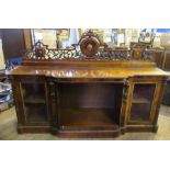 A 19th century walnut credenza, with ornate gilt metal moulded supastructure fitted, the break bow