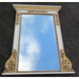 A white and gilt overmantel mirror, decorated with Classical leaves and scrolls, overall