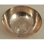 A white metal bowl, the base embossed with the Russian two headed eagle, weight 3oz, diameter 4.
