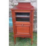 An Edwardian mahogany music cabinet, with part glazed door and pull out canterbury below, width