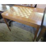 A Heal & Son Ltd mahogany rectangular games table, designed by R G F Rust, cabinet maker  Graham