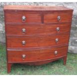 A 19th century bow fronted chest, of two short over three long drawers, raised on bracket feet,