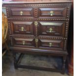 A 17th century style oak moulded front and bobbin moulded chest, of three long drawers, raised on