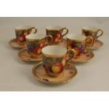 A set of six Royal Worcester tea cups and saucers, decorated all around with fruit to a mossy ground