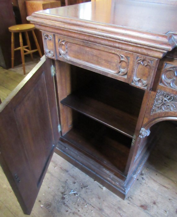 A late 19th century oak sideboard, with carved triangular back, fitted with a central drawer flanked - Image 4 of 4