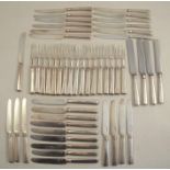 A set of seventeen silver fruit forks, London 1897, maker William Hutton & Son, together with a