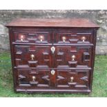 A 17th century style moulded front chest, of two short drawers over three long drawers, width