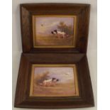 A pair of Crown Devon Fieldings framed porcelain plaques, gundogs in landscape by C R Hinton,