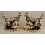 A pair of 19th century English porcelain table candlesticks, modelled as a horn of plenty with two