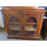 A 19th century walnut and crossbanded credenza, with oval glazed twin cupboard doors and ormalu