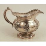 A Russian silver jug, with panels of flower and leaf decoration, weight 5oz