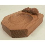 A Robert Mouseman Thompson oak ashtray, carved with a mouse