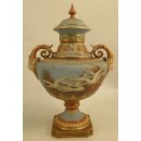 A Royal Worcester vase, decorated with swans to a powder blue ground by C H C Baldwyn, with