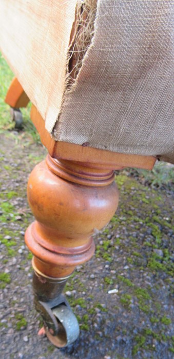 A Victorian upholstered armchair, with button back, on turned front supports, stamped C Hindley & - Image 3 of 4