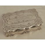 A 19th century silver snuff box, of shaped rectangular form, engraved with an inscription,