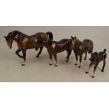 Four Beswick models, of bay horsesCondition Report: Large horse has a repaired leg the rest are