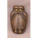 A Meiji period copper vesta case, having a hinged lid, in the form of an owl, with gilding on the