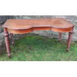 A Victorian walnut dressing table, with shaped front, fitted with two frieze drawers, raised on