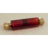 A Victorian double ended ruby glass scent bottle, with gilt caps
