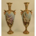 A Royal Worcester pedestal vase, decorated with swans to a powder blue ground by C H C Baldwyn, with