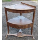 A 19th century mahogany corner washstand, fitted with a drawer to the middle section and a plant