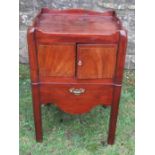 A 19th century mahogany commode, having two cupboard doors and pull out commode drawer, width 20.