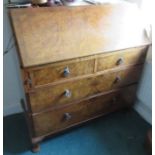 A reproduction walnut bureau, the cross banded flap opening to reveal a part fitted interior,