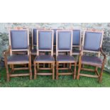 A set of eight Robert Mouseman Thompson oak dining chairs, comprising two carvers and six singles,