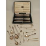A collection of hallmarked silver flatware, to include sugar tongs, spoons, pickle forks etc and a
