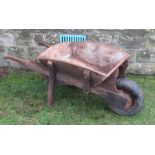 A 19th century wooden garden wheelbarrow, with replacement rubber tyre, length approximately 58ins